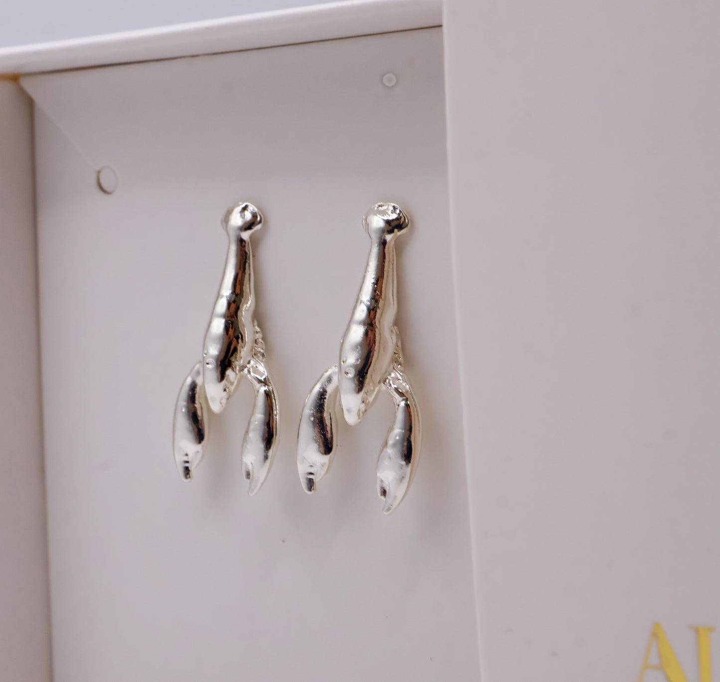 Aretes langosta en baño de oro o plata